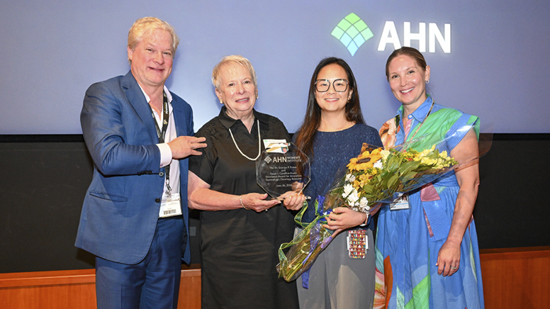 Susan presenting The Dr. George P. Evans and Susan I. Cavalline Evans Excellence Award for Innovative Gynecologic Oncology Research